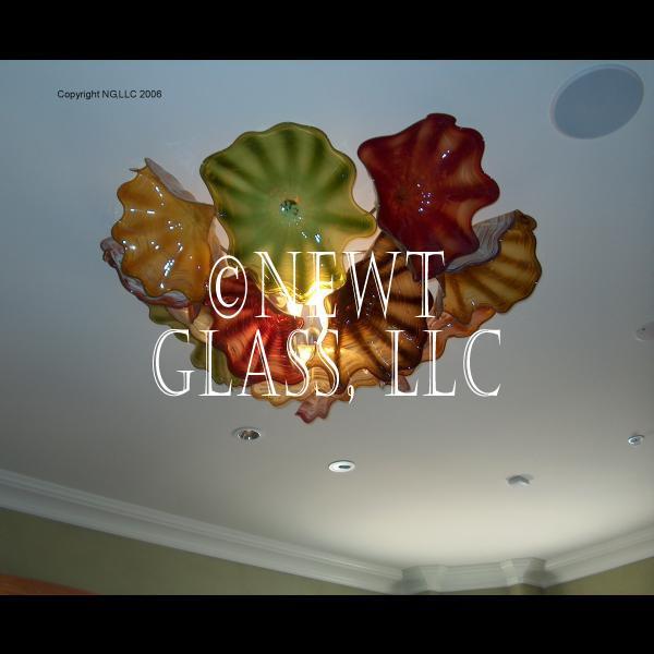 Blown Glass Ceiling Flowers
 
	An array of art glass flowers arranged as a ceiling fixture with lighting
