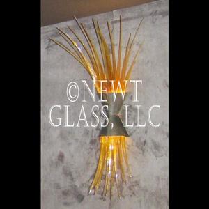 Theatre Sconce
 One of a series of sconces with a metal frame and amber lighted spires