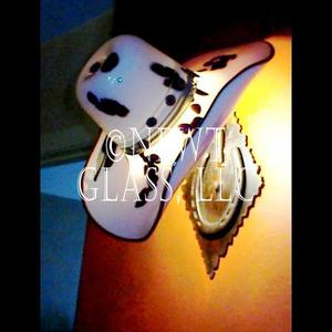 Hat Sconce
 
	Blown glass cowboy hat made into a lighted wall sconce
