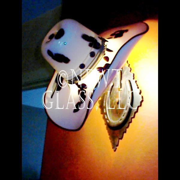 Hat Sconce
 
	Blown glass cowboy hat made into a lighted wall sconce
