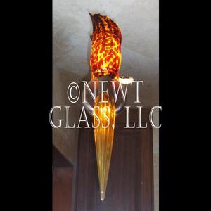 Flame and Torch Sconce
 
	Two sconces installed on a mirror
