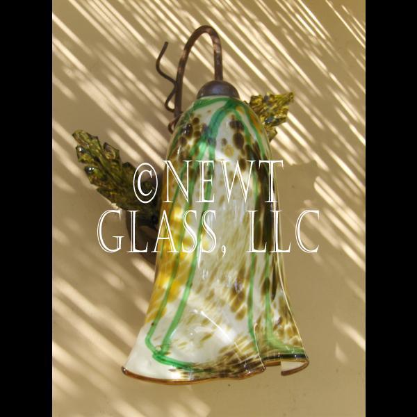 Newt's Garden Angel
 Two exterior sconces at Newt's with leaves installed on either side of patio door