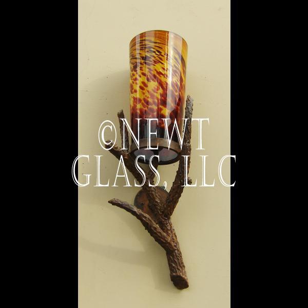 Newt's Rustic Sconce
 Rustic exterior sconce at Newt's with metal base made to look like wood