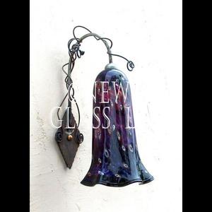 Newt's Purple Sconce
 
	Exterior sconce of purple glass with murini glass accents at Newt's
