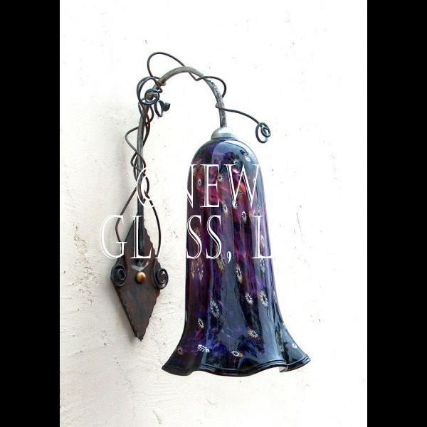 Newt's Purple Sconce
 
	Exterior sconce of purple glass with murini glass accents at Newt's
