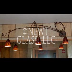 Men's Room
 
	3 light fixture in offset form
